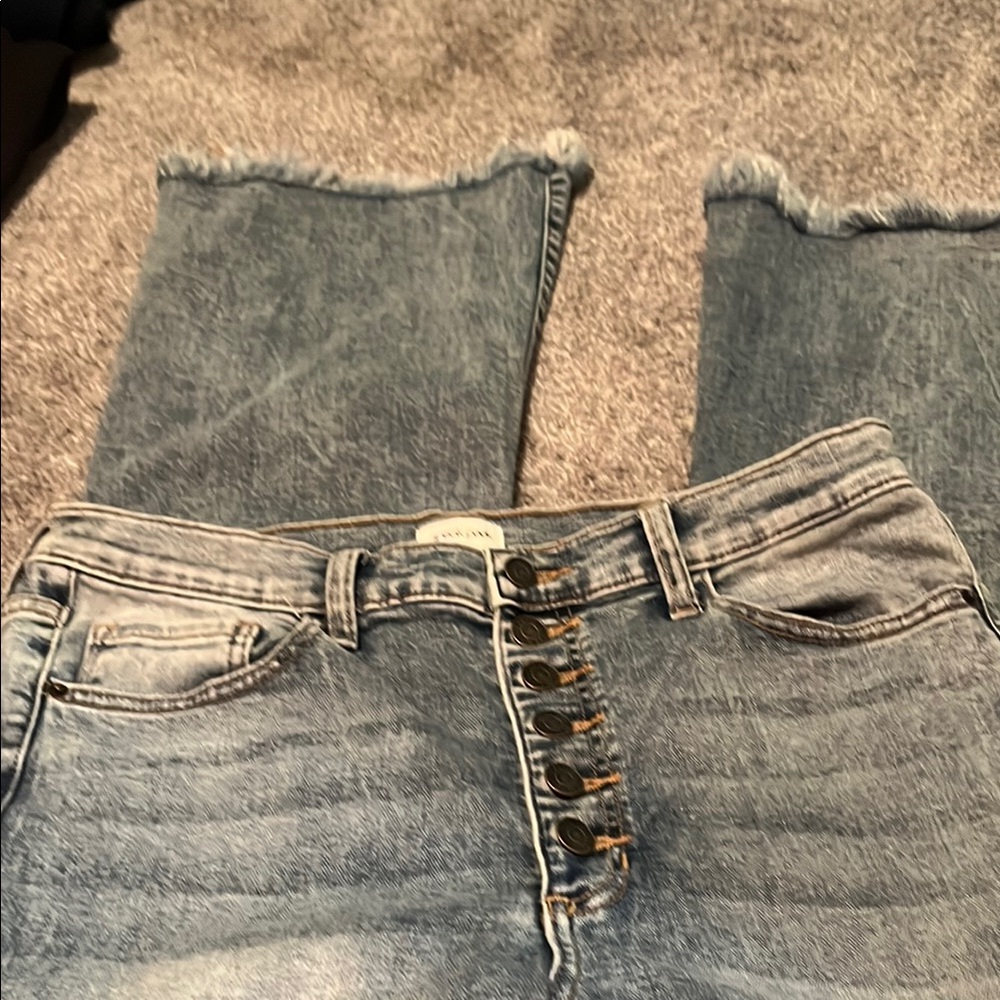 Big bell bottom jeans with fringe on bottom. No tags but never worn. 4 pockets